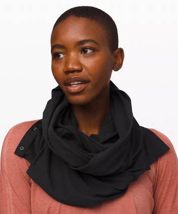 model wearing the black scarf around their neck