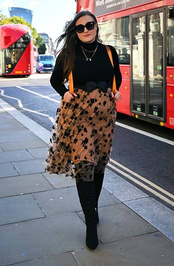 reviewer walking successful london wearing the skirt
