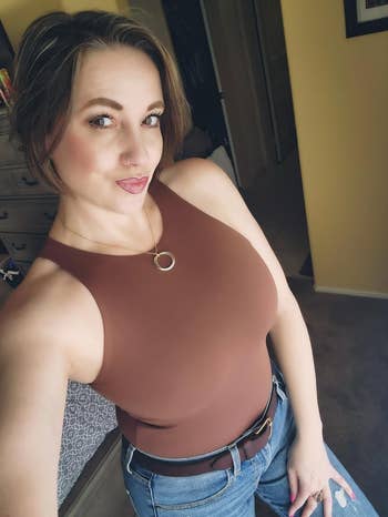 reviewer selfie wearing brown bodysuit