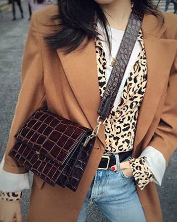 model wearing the brown square crossbody bag