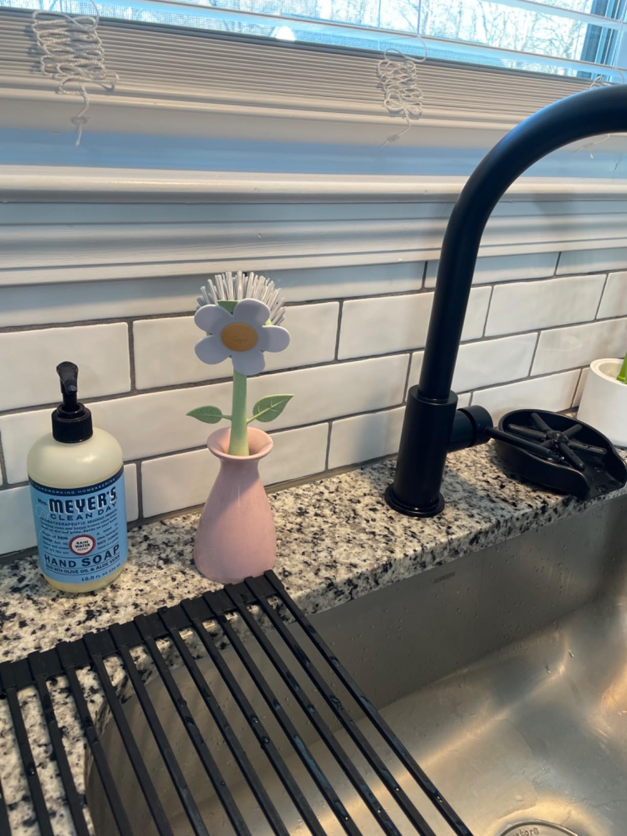 Kitchen descend  with a faucet, manus  soap, and a flower-shaped scrub brushwood  successful  a vase