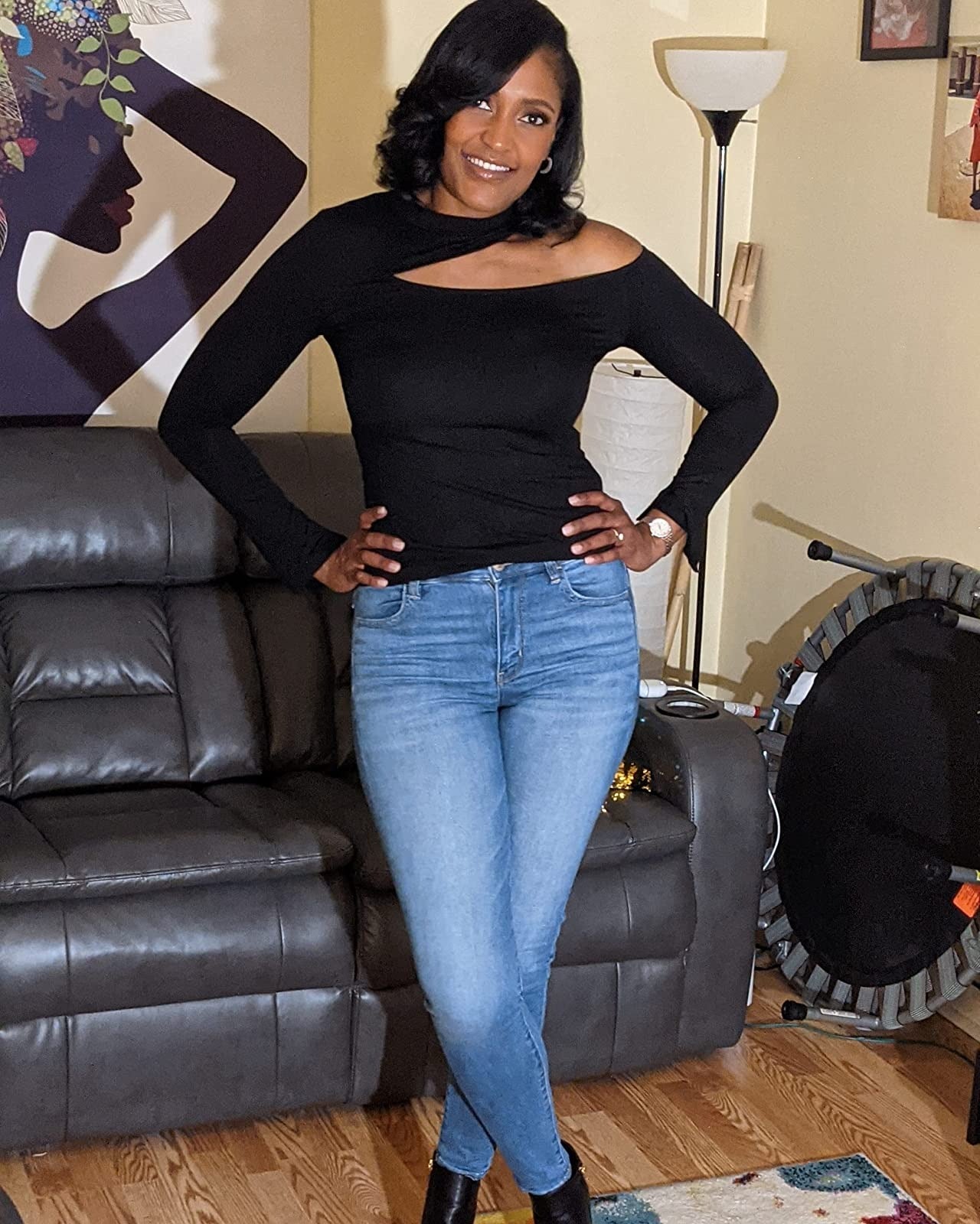 reviewer wearing the black cut out top with jeans