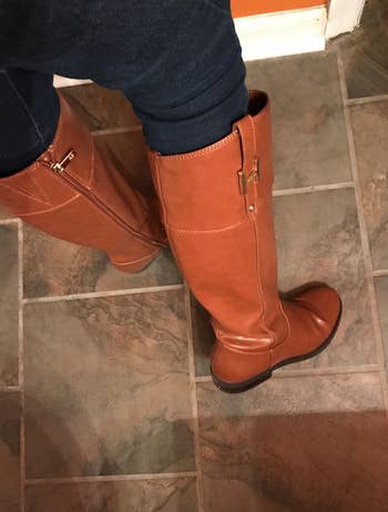 close up of the cognac boots on a reviewer's feet