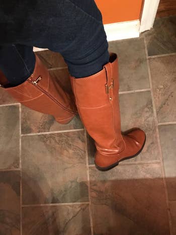 close up of the cognac boots on a reviewer's feet