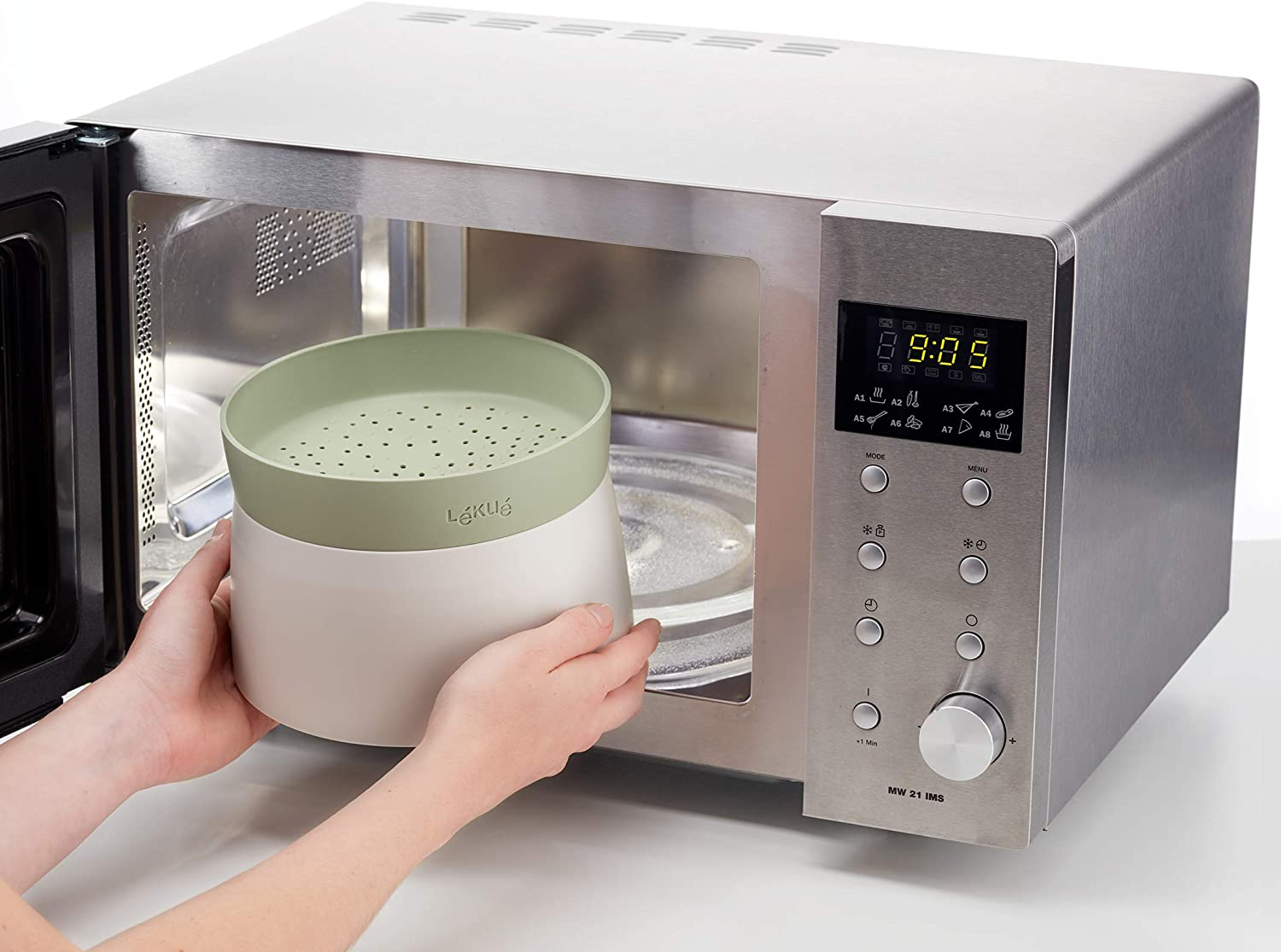 The green grain cooker being put inside a microwave