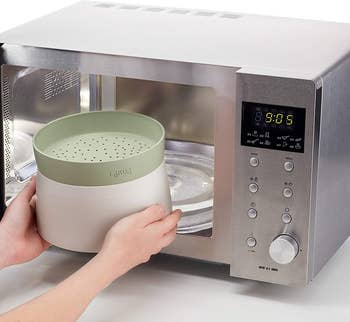 The green grain cooker being put inside a microwave