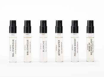 Six Byredo perfume illustration bottles, labeled Bal d'Afrique, Bibliothèque, Blanche, Gypsy Water, Mojave Ghost, and Rose of No Man's Land