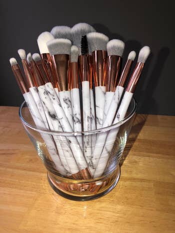 reviewer image of the marble makeup brushes in a holder