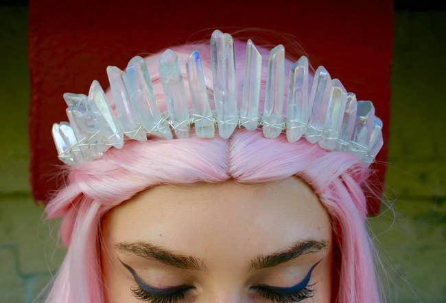 Model is wearing the crystal crown with silver wire wrapped around the base of them