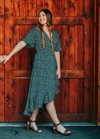 reviewer wearing the dress in green floral