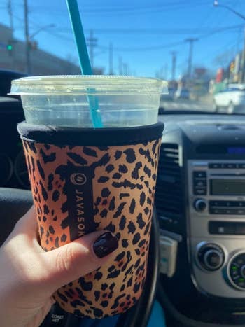 Reviewer using leopard version on iced drink in their car
