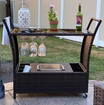 Reviewer image of the outdoor bar cart with glasses