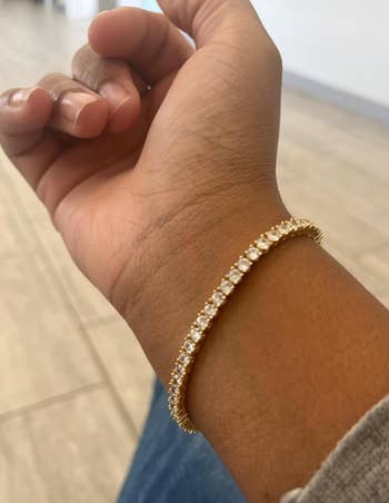 a reviewer wearing the bracelet 