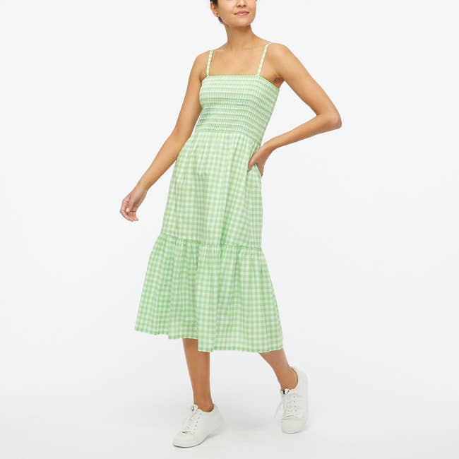 model in light green spaghetti strap dress