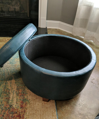 reviewer photo of teal round storage ottoman with lid open