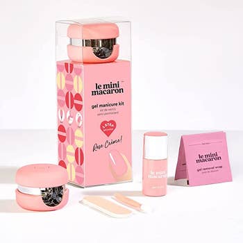 A nail set with a mini macaron nail dryer, polish, and instructions 