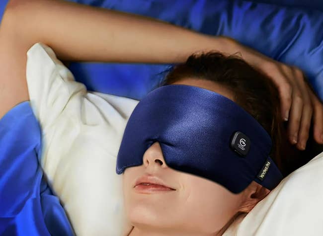 person lying successful furniture wearing a sleek slumber disguise with Bluetooth headphones, looking relaxed and comfortable