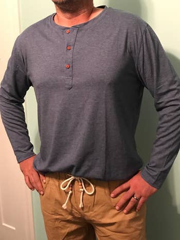 reviewer wearing the long-sleeve henley in blue 