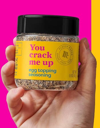 Hand holding a jar of 