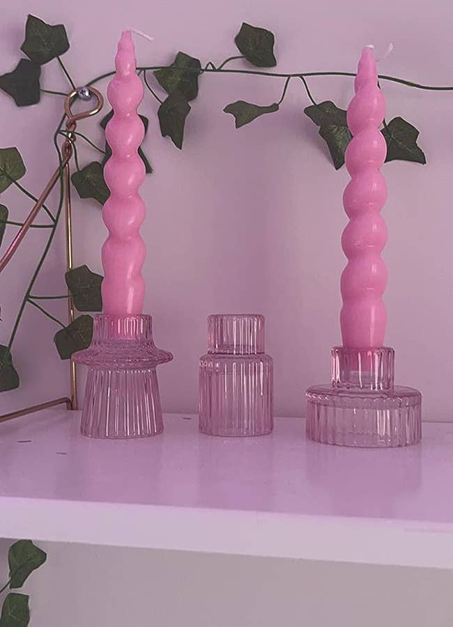pink candle holders in different shapes