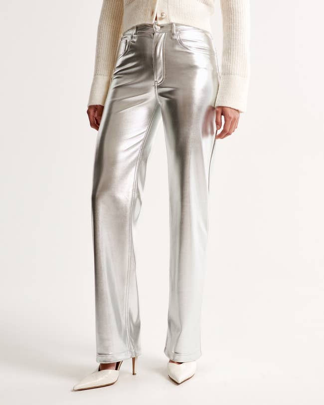 model posing in the silver pants