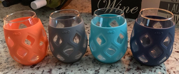 Reviewer image of orange, gray, blue, and navy glasses