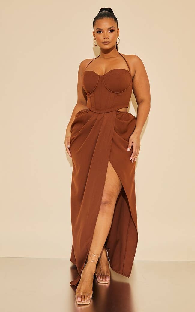 model wearing the corset ruched maxi dress in brown