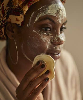 model washing face with reusable makeup pad