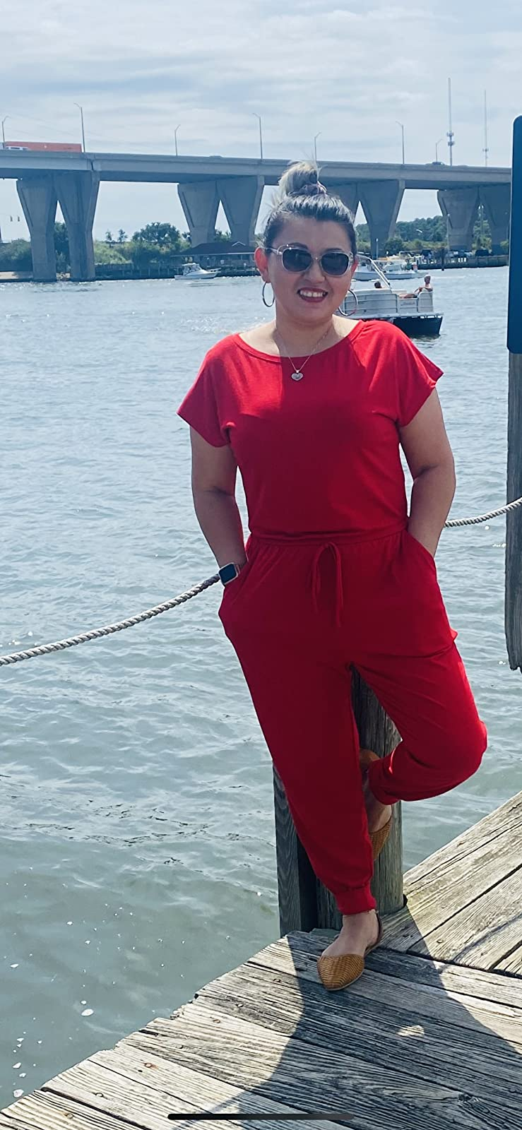 reviewer wearing the red jumpsuit while standing on a pier