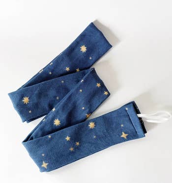 A robe curl band in blue with gold stars