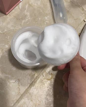 reviewer's cleanser worked into a foam