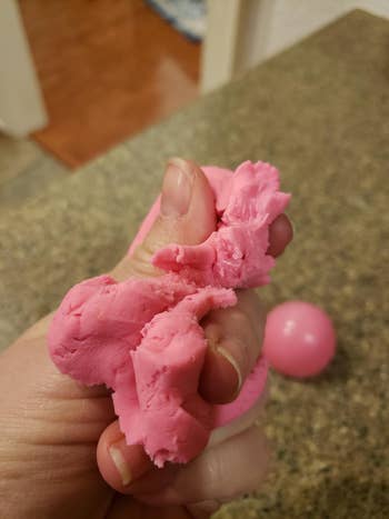 Reviewer's photo holding the pink Play-Doh