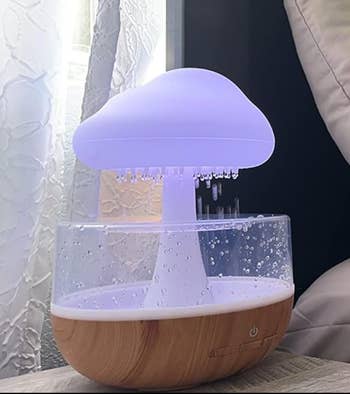 the cloud lit up white perched on an end table 