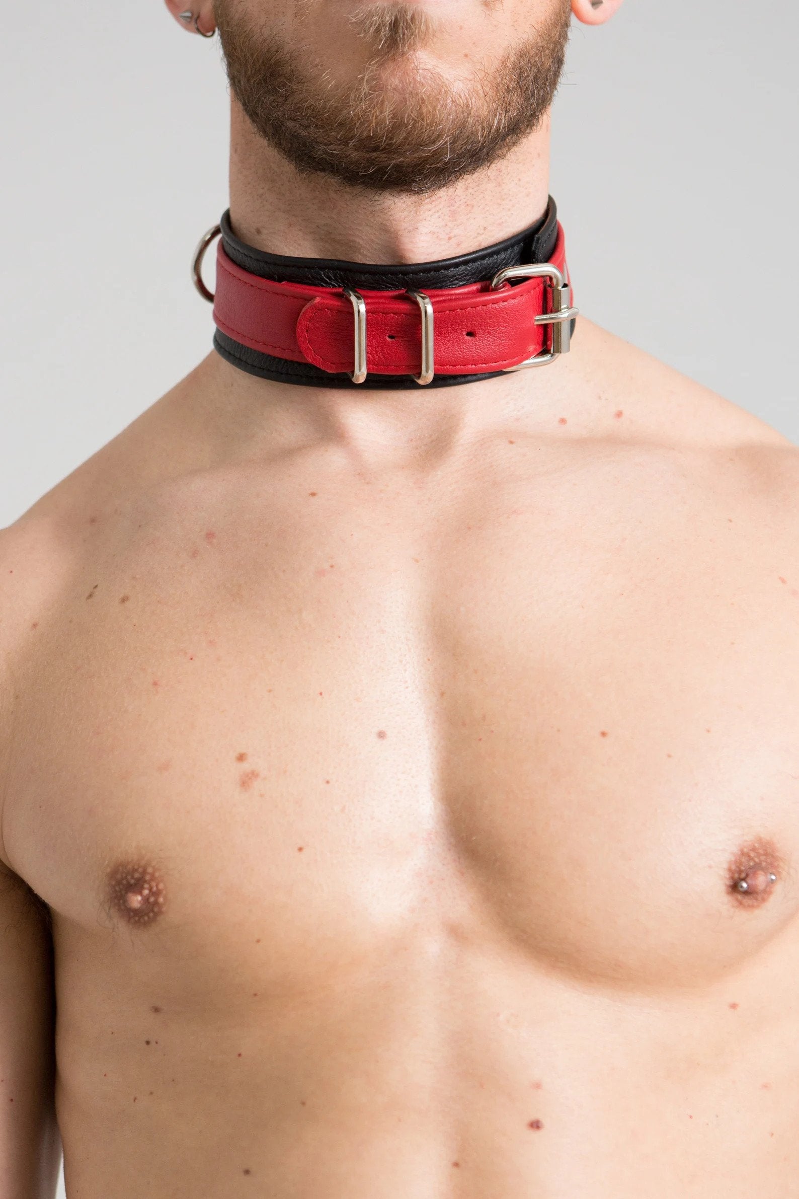Model wearing red and black leather collar