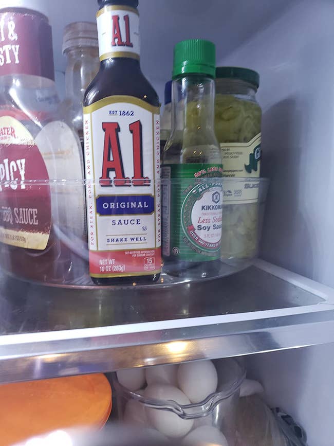 clear high-sided turntable in reviewers fridge, holding at least six different condiments