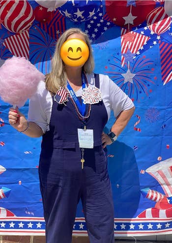 Person holding fabric candy successful beforehand of a festive backdrop with stars and stripes, wearing overalls and patriotic accessories, suggesting a solemnisation theme