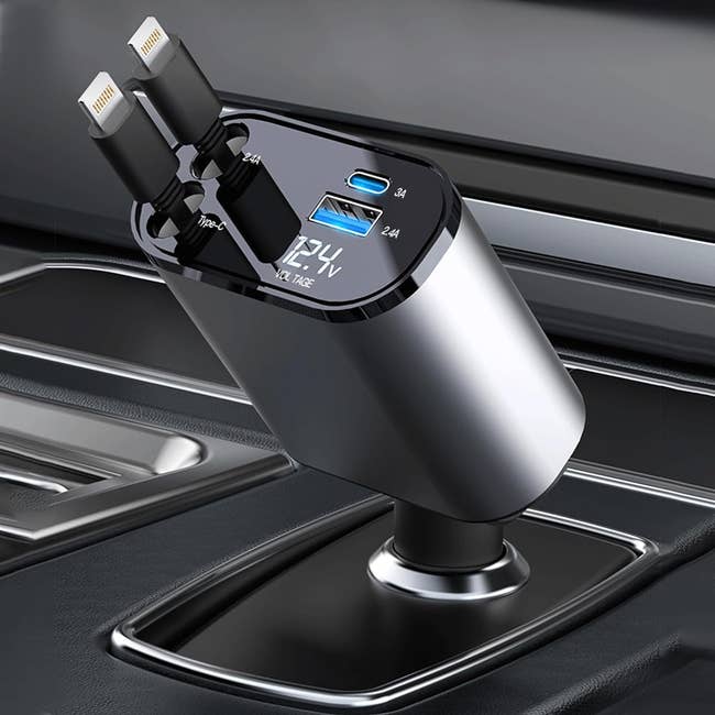 Car USB charger plugged into vehicle's cigarette lighter port