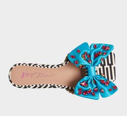 version in black and white graphic print with blue bow and pink jewels