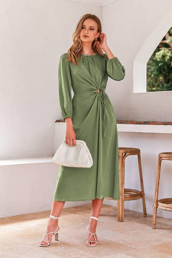 model wearing green a-line dress