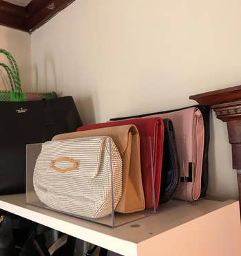 reviewer's clutches and wallets in the clear organizer on a shelf