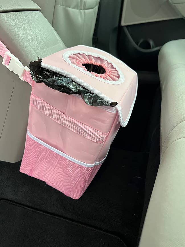 a pink travel garbage can for the car