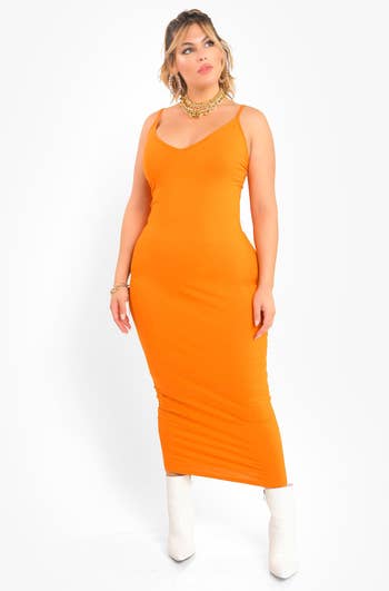 model in orange spaghetti strap v neck dress