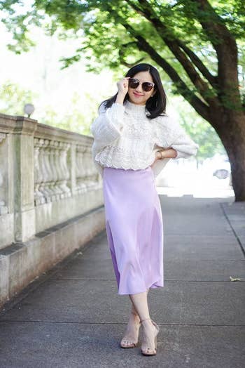 a reviewer wearing the skirt in pink