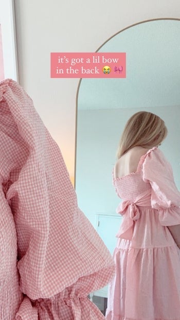 BuzzFeed writer showing the back of the dress and how it has a bow