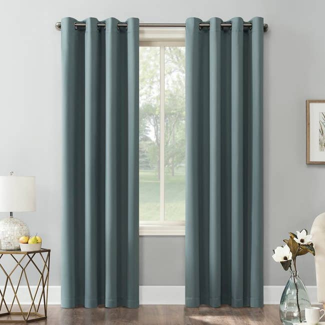 Two of the curtain panels in the color Mineral