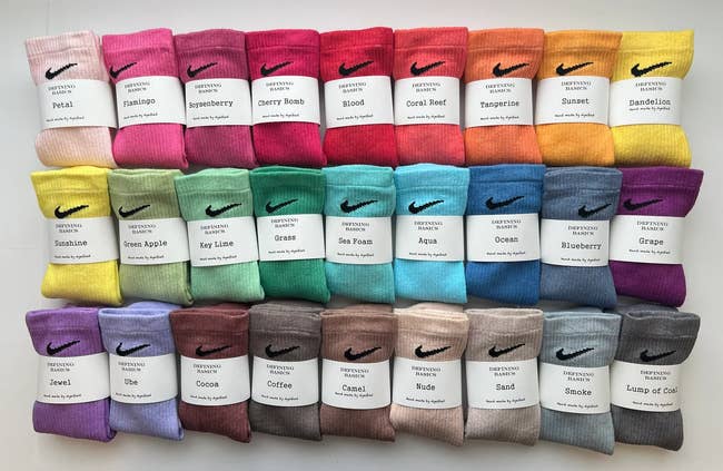dozens of Nike crew socks in different colors ranging from rainbows to neutrals 