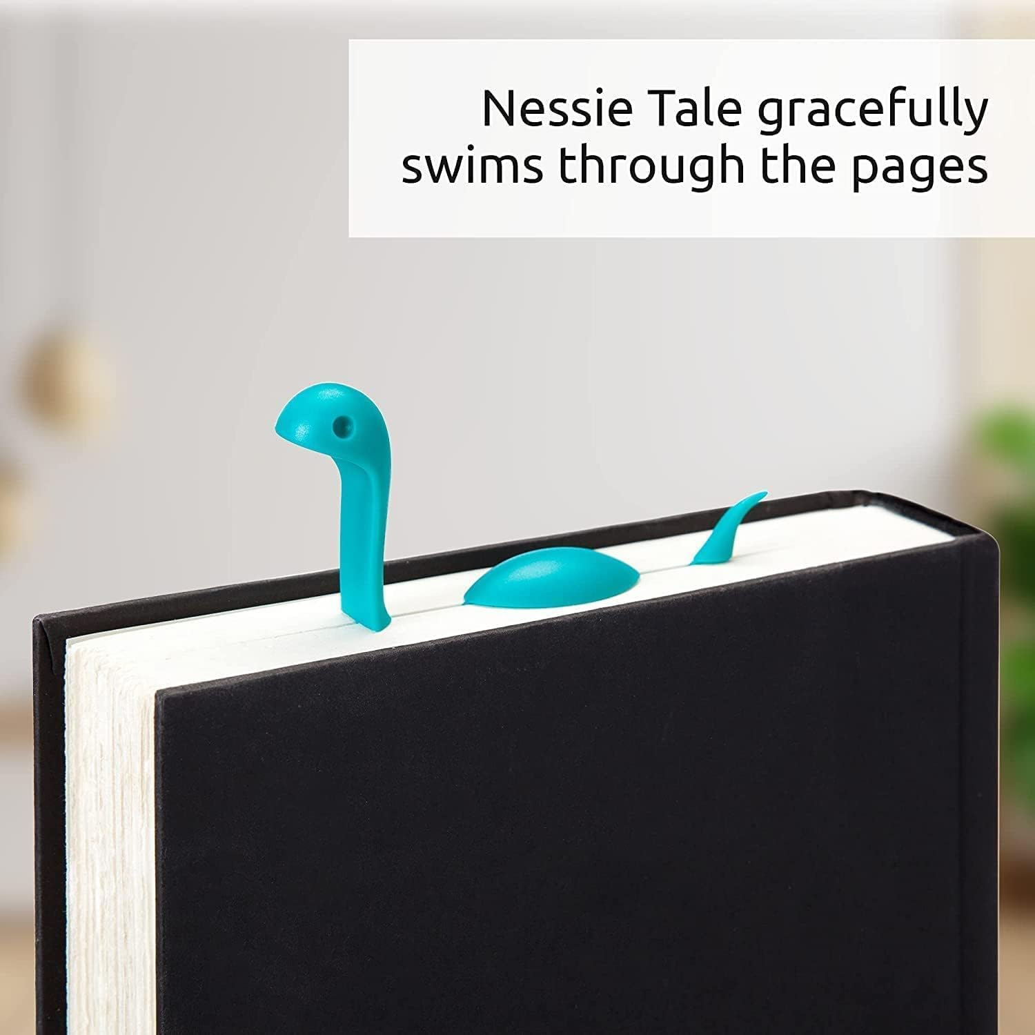Nessie-shaped bookmark emerges from a book, bringing charm and creativity to speechmaking  sessions