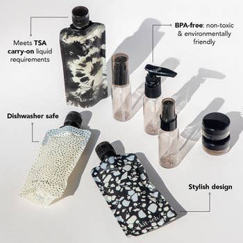 The 11-piece set of pouches, small bottles, and small containers in black and white abstract prints 