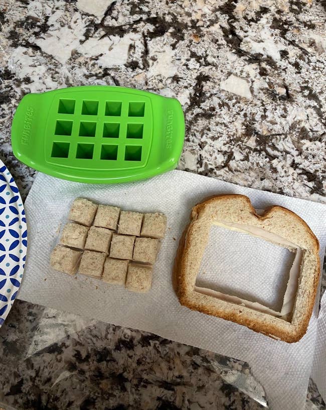 A reviewer's sandwich cut into small cubes