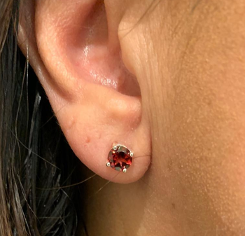 Reviewer wearing red January stud earring